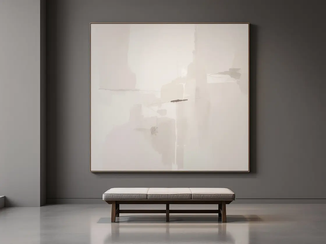 An empty museum bench in front of a large abstract painting